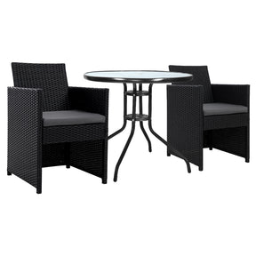 Swanhaven rattan outdoor bistro set with two woven chairs and a glass top table in a garden