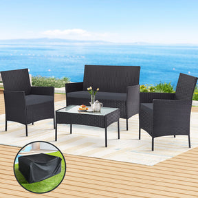 Tuross grey wicker outdoor sofa set with cushions and tempered glass table on a deck