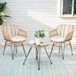 Natural rattan wicker two seat bistro setting with table on a balcony