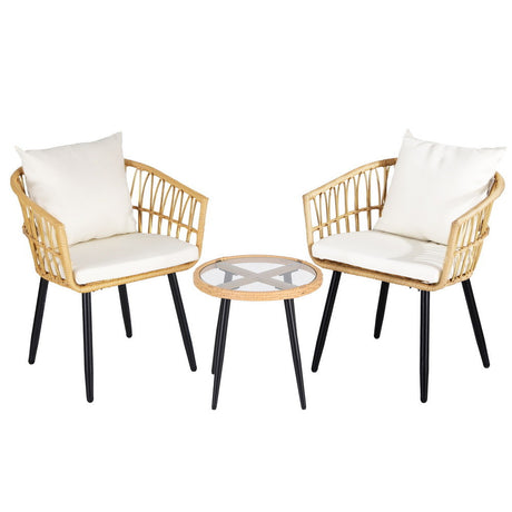 Carrara natural wicker outdoor lounge set in an outdoor setting