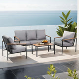 Elanora black steel outdoor lounge set in an outdoor setting