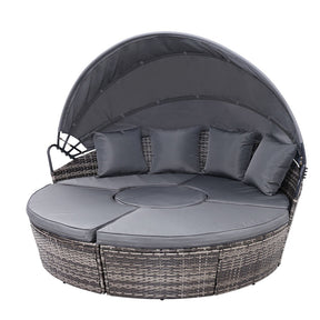 Broken Head grey wicker outdoor sun lounge day bed with cushions in a garden