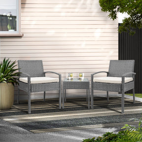 Grey rattan wicker two seat bistro setting with table on a balcony