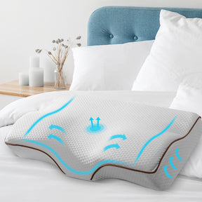 Pentecost memory foam contour pillow in grey on a bed