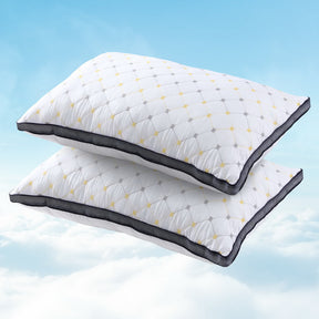 Cid luxury microfibre pillows pair on a made bed