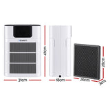 Pet air purifier placed in a living room beside a cat