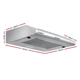 Slim stainless steel range hood mounted above a kitchen cooktop