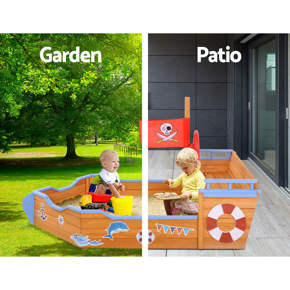 Wooden pirate boat sandpit with steering wheel and bench seats