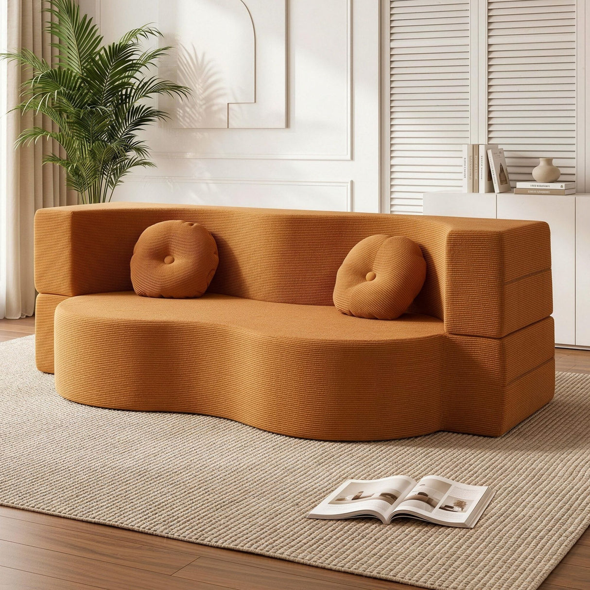 Estartit Orange corduroy sofa bed in a modern living room