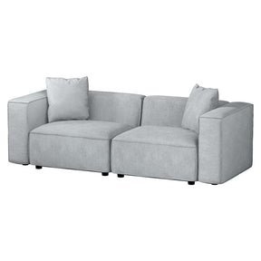Sitges grey soft linen 2 seater modular sofa chaise in a small living room