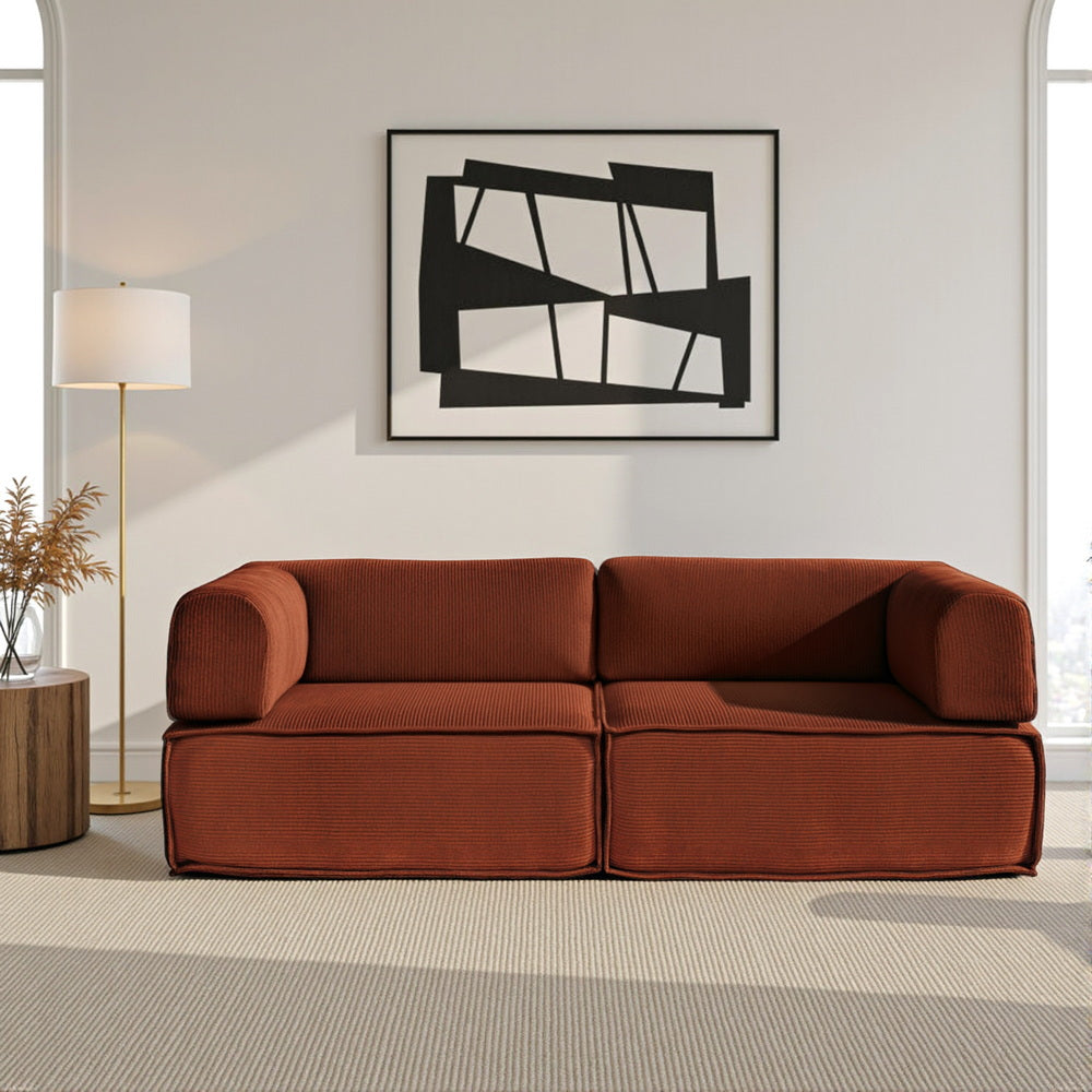 Deltebre Orange corduroy sofa bed in a modern living room