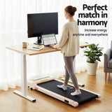 Kingston oak electric standing desk with walking pad in a home office
