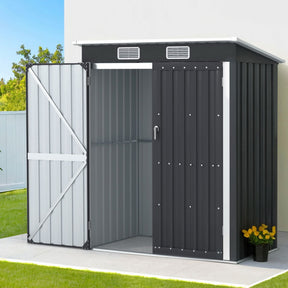 Corrigin compact grey garden shed with double doors in a garden