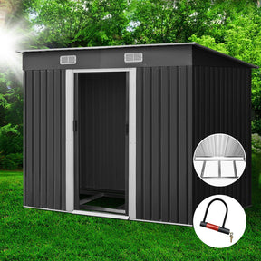 Northam grey garden shed with metal base and sliding doors in a backyard