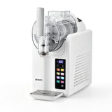White slushie machine dispensing a frozen drink into a glass