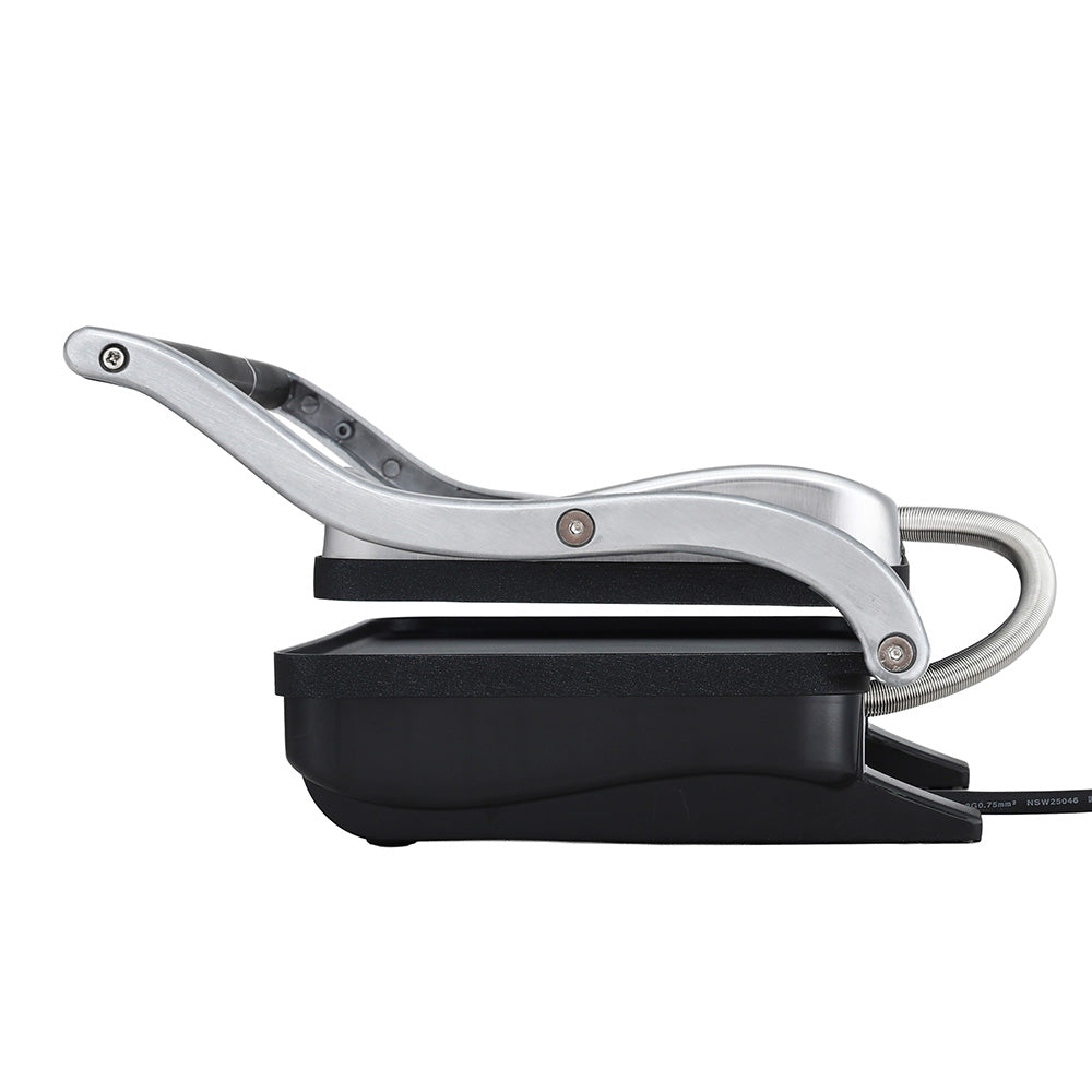 Two toasted sandwiches cooking on the 1000 W sandwich press