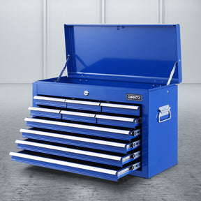 Blue 10 drawer steel tool chest with open drawers in a garage workshop