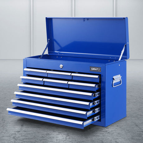 Blue 10 drawer steel tool chest with open drawers in a garage workshop