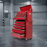 Red 14 drawer steel tool chest with open drawers in a garage workshop
