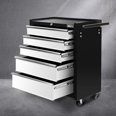 Grey 5 drawer steel tool trolley on castors in a garage workshop
