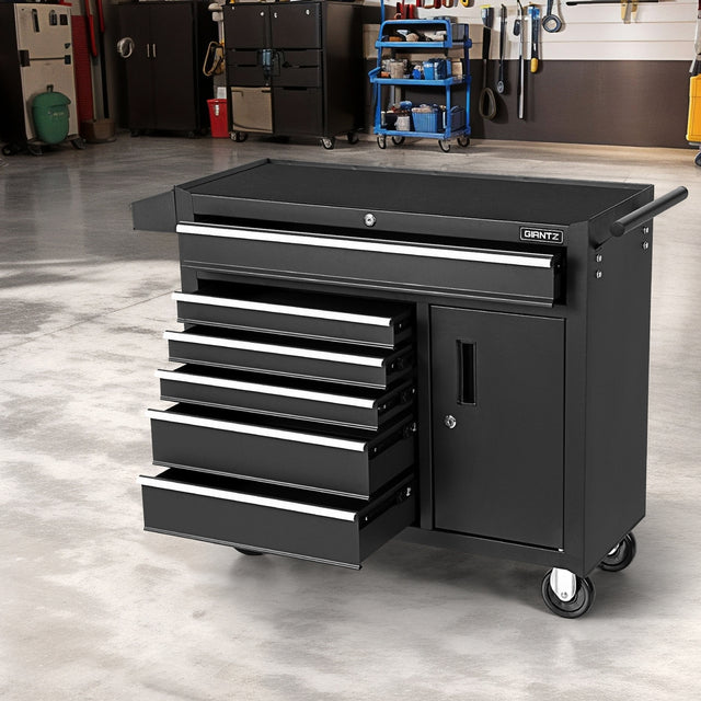 6 drawer steel tool chest with open drawers in a garage workshop