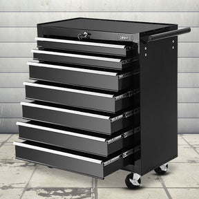 Black 7 drawer steel tool trolley on castors in a garage workshop