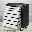 Grey 7 drawer steel tool trolley on castors in a garage workshop