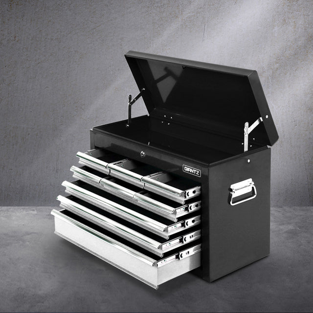 Grey 9 drawer steel tool chest with open drawers in a garage workshop
