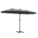 Black cantilever outdoor umbrella shading a patio