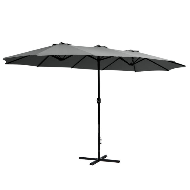 Black cantilever outdoor umbrella shading a patio