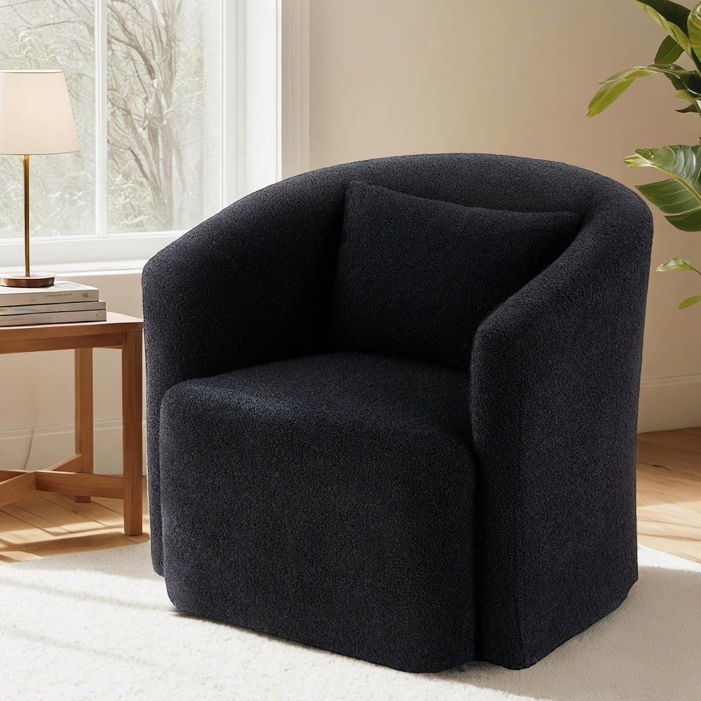 Hampton black sherpa fleece swivel armchair in a modern living room