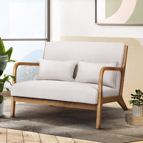Yellow Rock beige faux linen two seater armchair in a modern living room