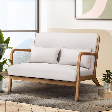 Yellow Rock beige faux linen two seater armchair in a modern living room