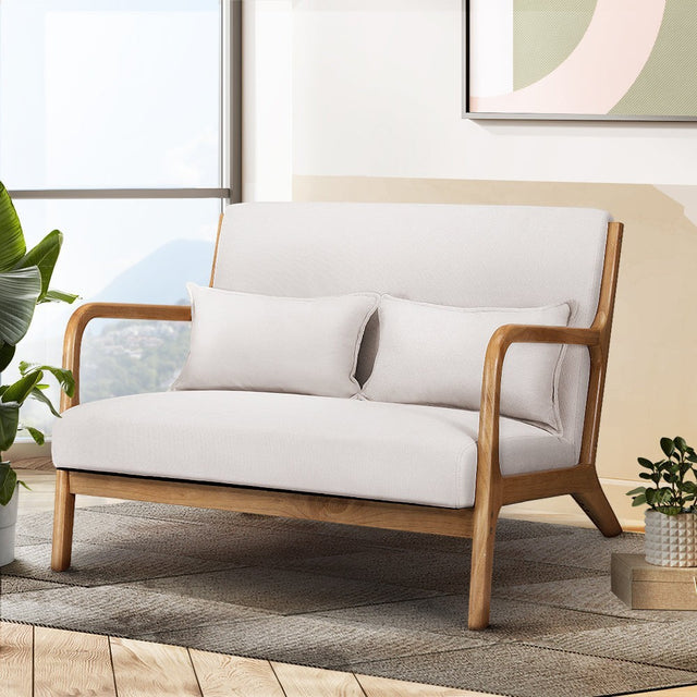 Yellow Rock beige faux linen two seater armchair in a modern living room