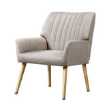 Faulconbridge beige faux fabric armchair in a modern living room