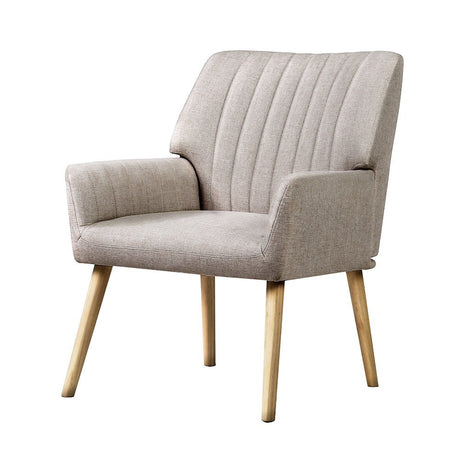 Faulconbridge beige faux fabric armchair in a modern living room