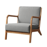 Springwood light grey faux fabric armchair in a modern living room