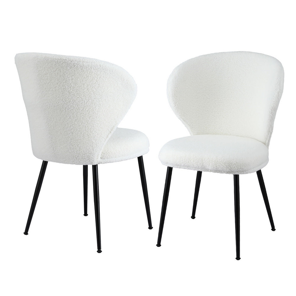 Kingscote white sherpa wing back dining chairs, set of two, with steel legs in a dining room