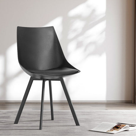 Frankston black upholstered dining chair in a modern Australian kitchen