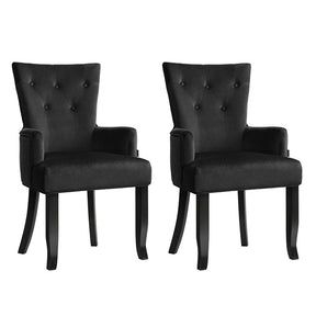 Summertown black velvet French Provincial dining chairs with solid wood legs in a dining room