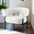Medlow Bath white boucle accent chair in a modern living room