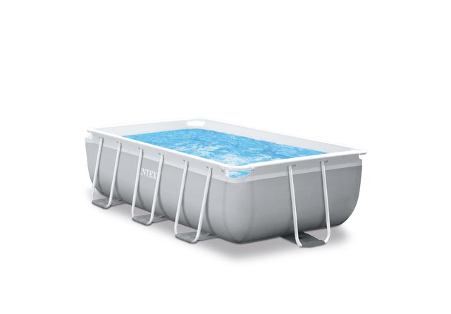 Rectangular above ground metal frame swimming pool with filter pump in a backyard