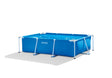 Compact rectangular above ground frame swimming pool in a small backyard