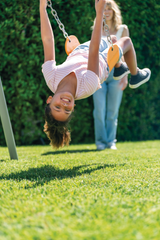Three feature glider swing set outdoors