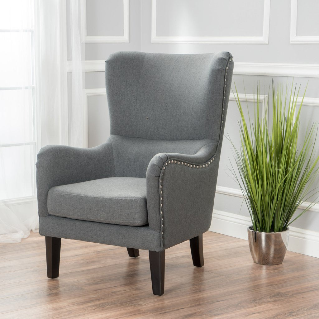 Evans grey fabric armchair in a modern living room