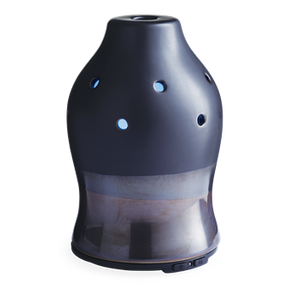 Ansouis matte black stoneware ultrasonic aroma diffuser on a bedside table