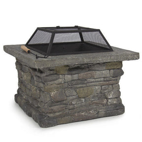 Victor Harbor faux stone fire pit table with iron bowl and BBQ grill on a patio