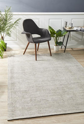 Nain stone cotton rayon area rug with soft silk lustre in a modern lounge