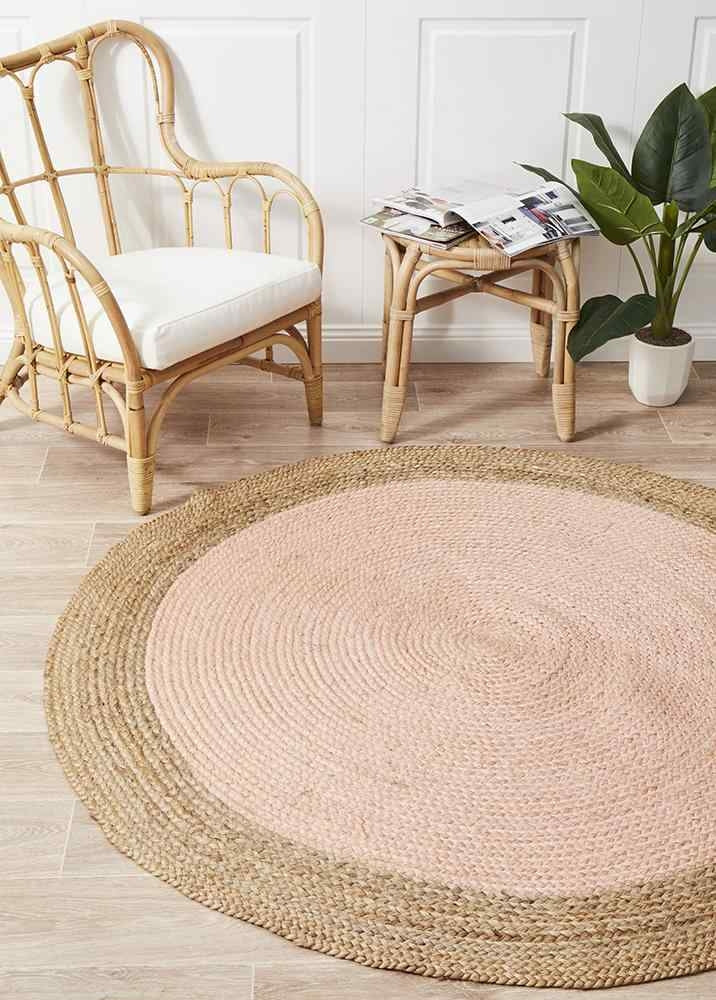 Hand-braided pink jute round rug with flatwoven finish, 120cm diameter