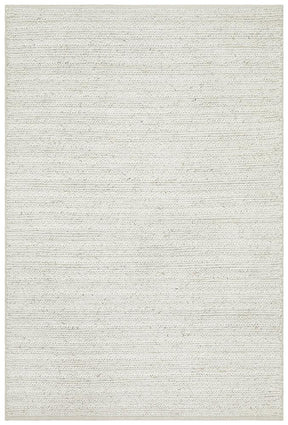 Yazd ivory wool viscose area rug with plush pile in a refined bedroom